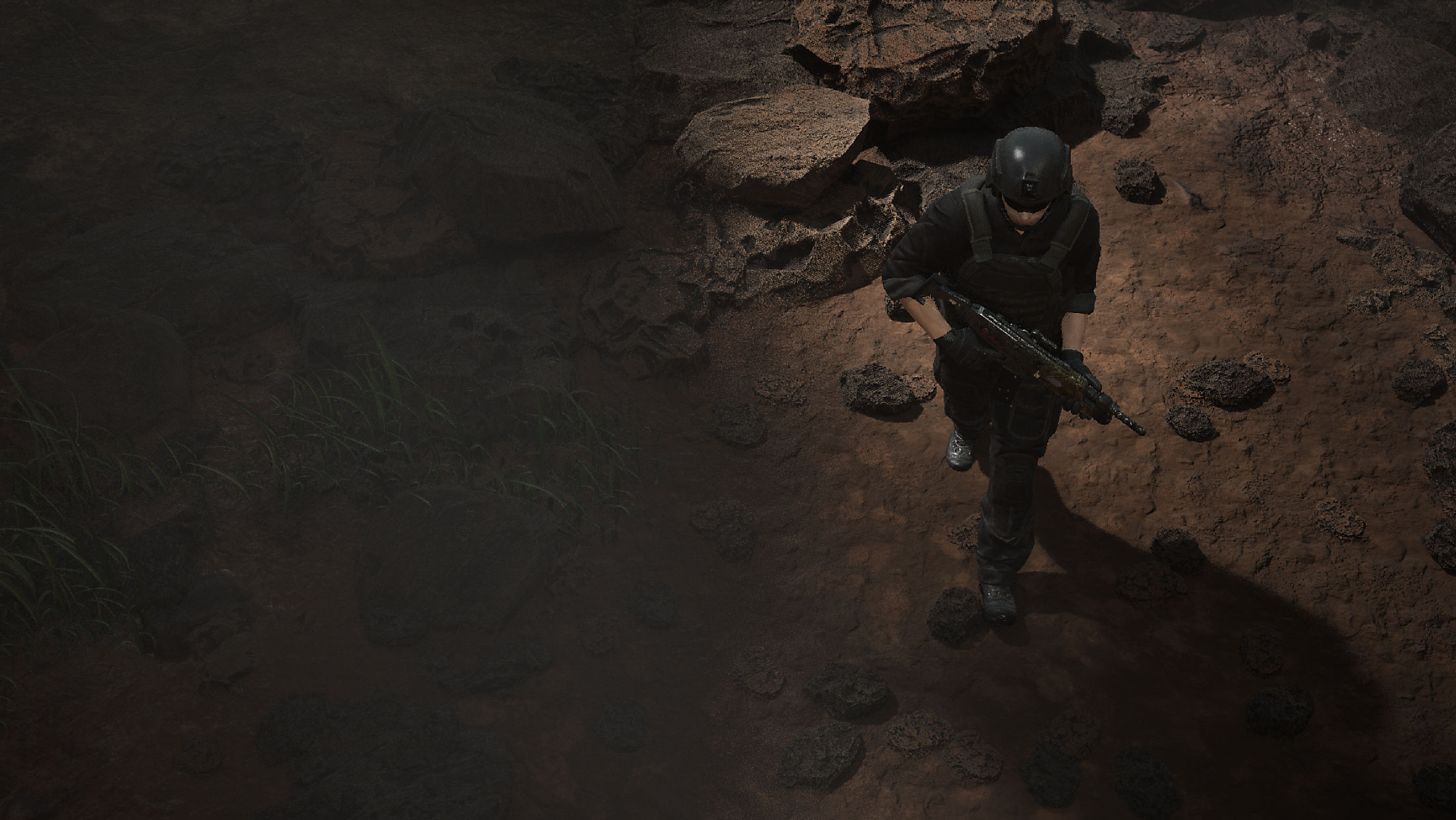 High angle shot of a tactical soldier walking on reddish rocky ground with a rifle, partially lit by sunlight.